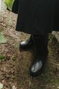 Woman in Black Leather Boots Standing on Brown Soil