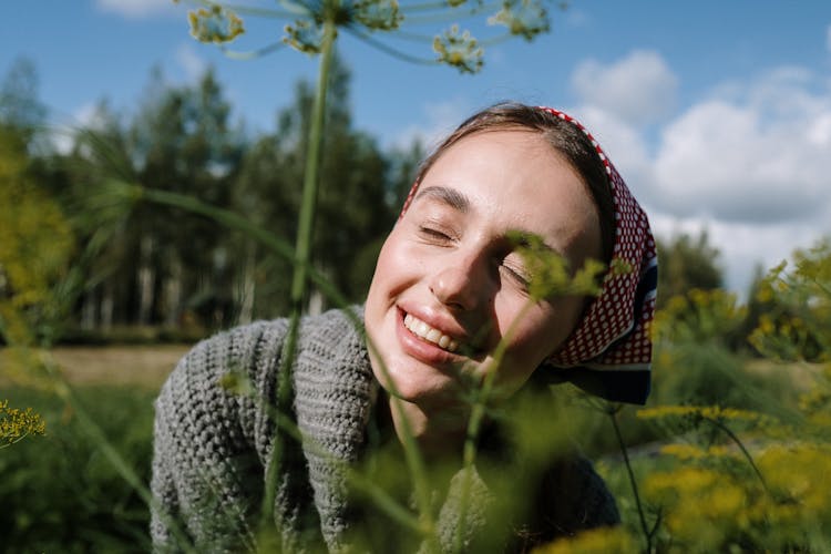 Portrait Of A Woman With A Headscarf Smiling