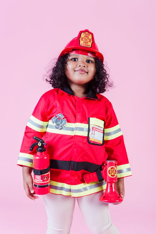 Funny black girl in firefighter uniform