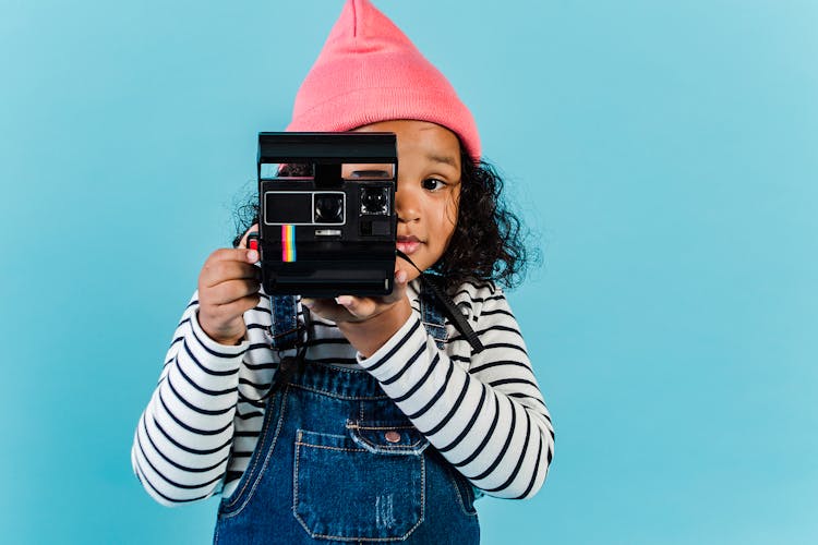 Sweet Black Girl Taking Pictures On Film Camera