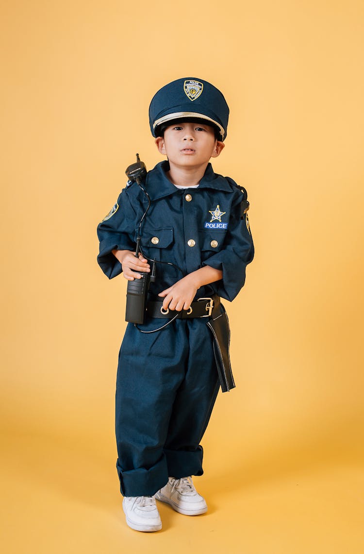 Cute Asian Boy In Policeman Costume