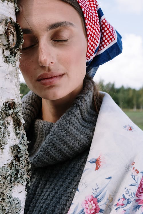 Woman in Gray Scarf and White Red and Black Floral Scarf