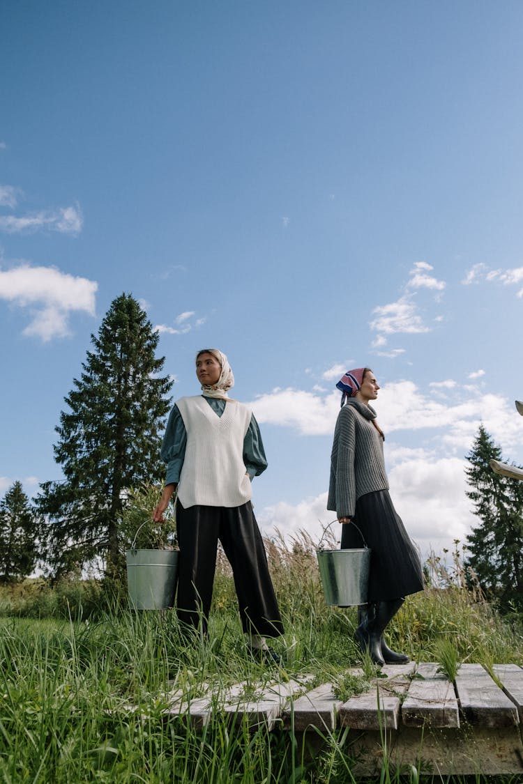 Women Carrying Buckets Of Water