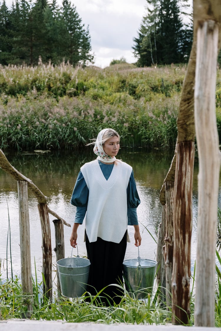 Woman Carrying Buckets Of Water