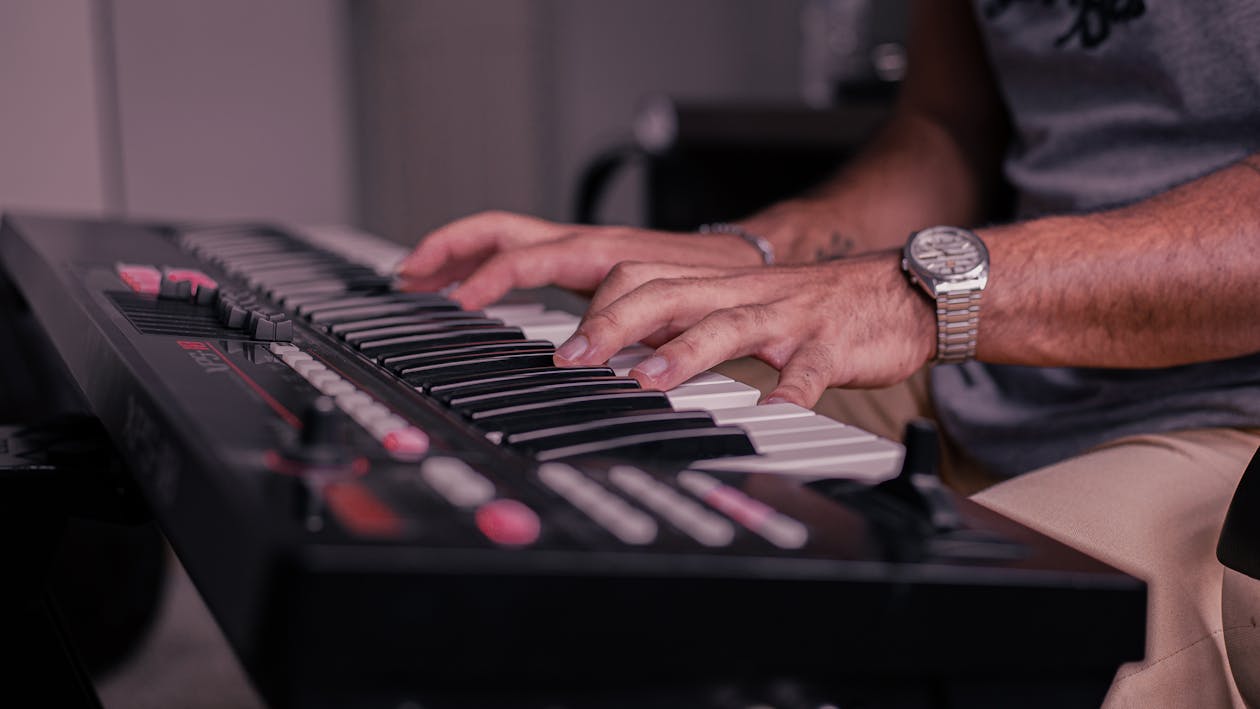 A Person Playing the Keyboard ยท Free Stock Photo