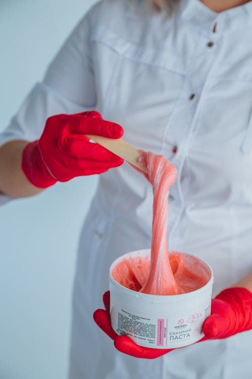 Free Crop woman with jar of sugaring paste Stock Photo