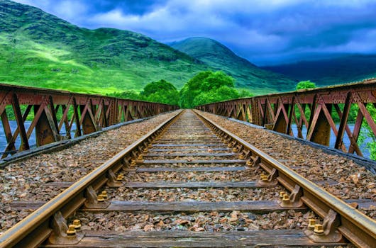 Brown Train Railway Near Mountain