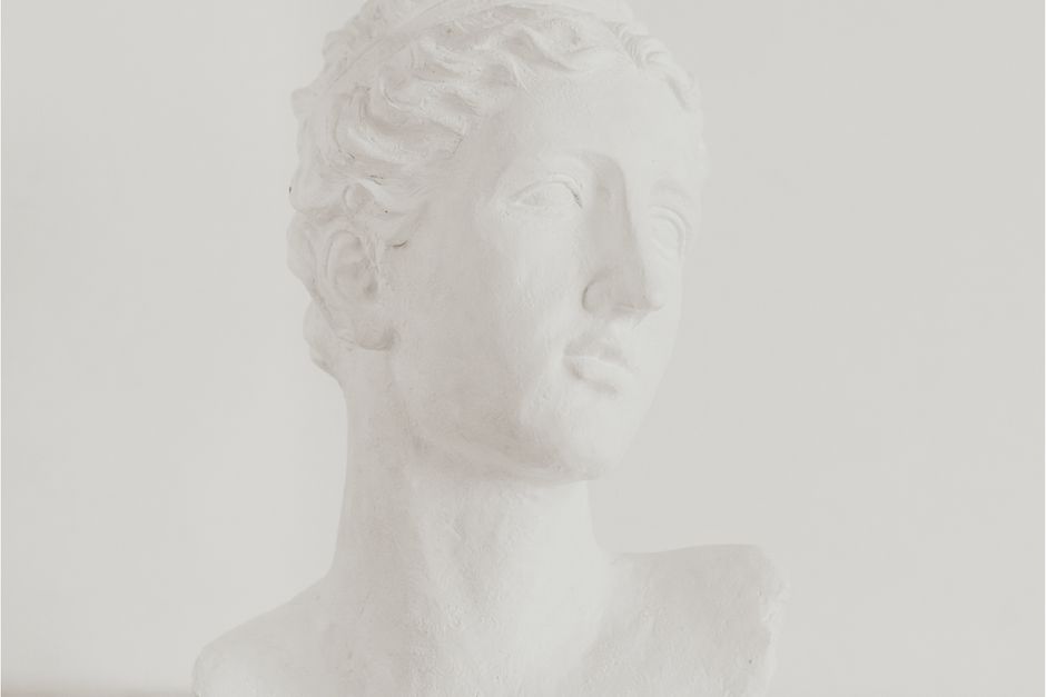 Close-up of an elegant white marble head bust sculpture showcasing classical art.