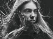 Woman in Black Shirt With Silver Nose Piercing