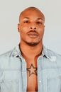Portrait of a Man With Star Tattoo on a Chest