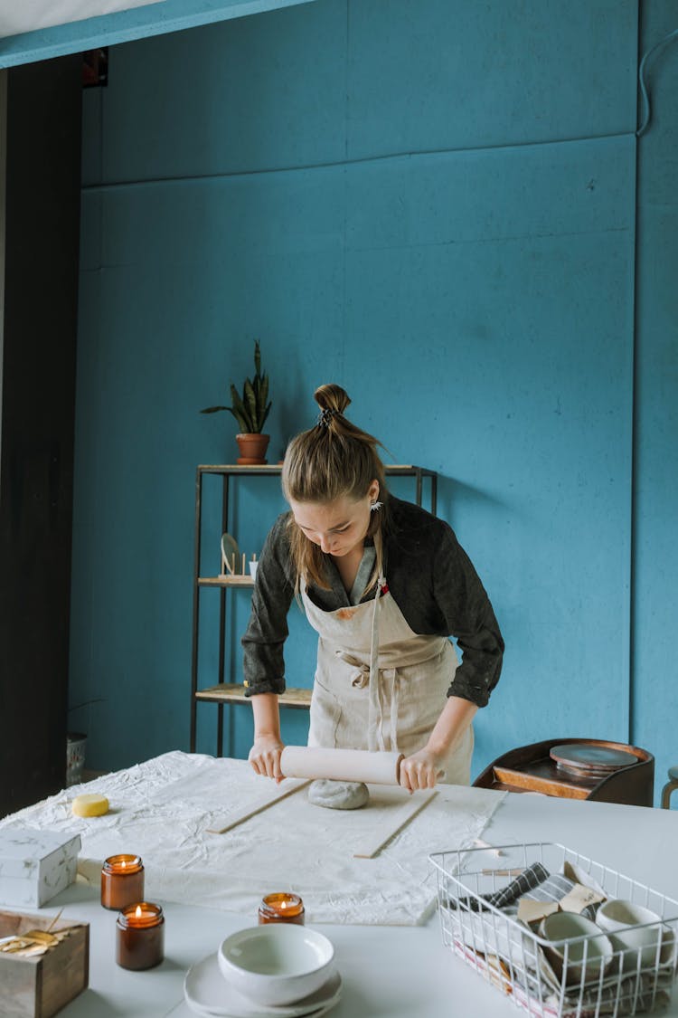 Woman Shaping A Clay