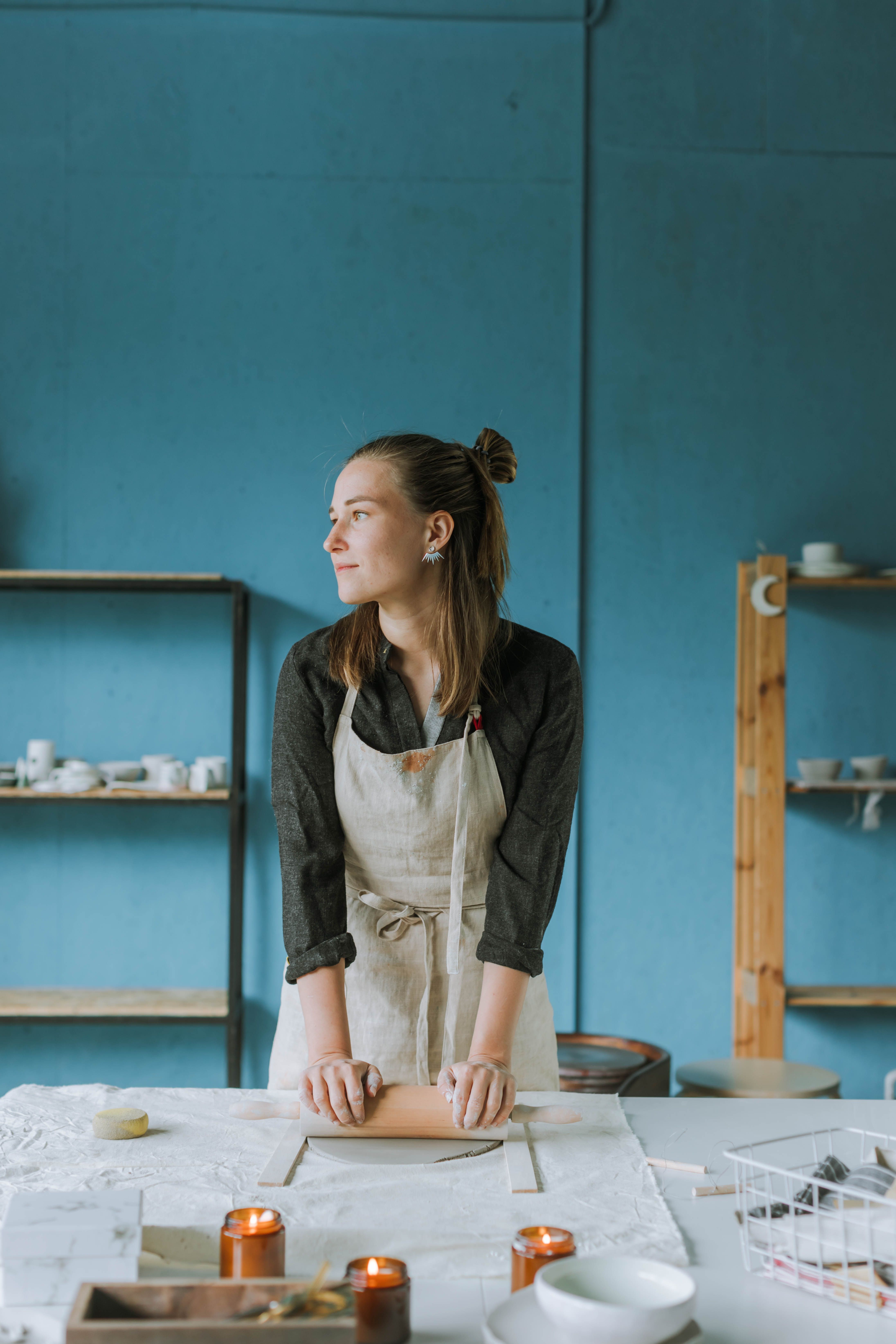 Woman Wearing an Apron Doing Pottery · Free Stock Photo