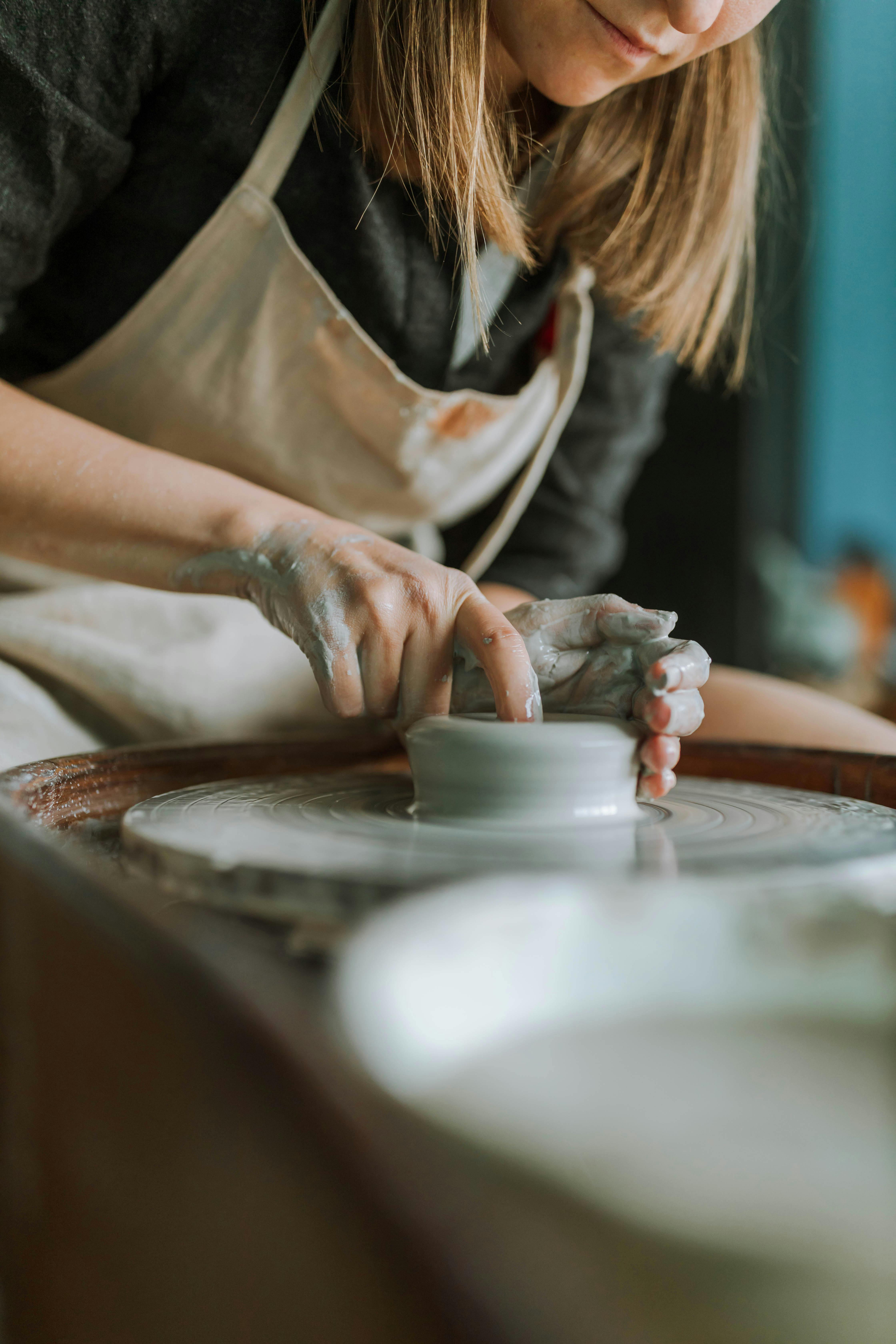 Girl Making a Clay Bowl on Sculpting Wheel Stock Photo - Image of material,  mentoring: 83556142