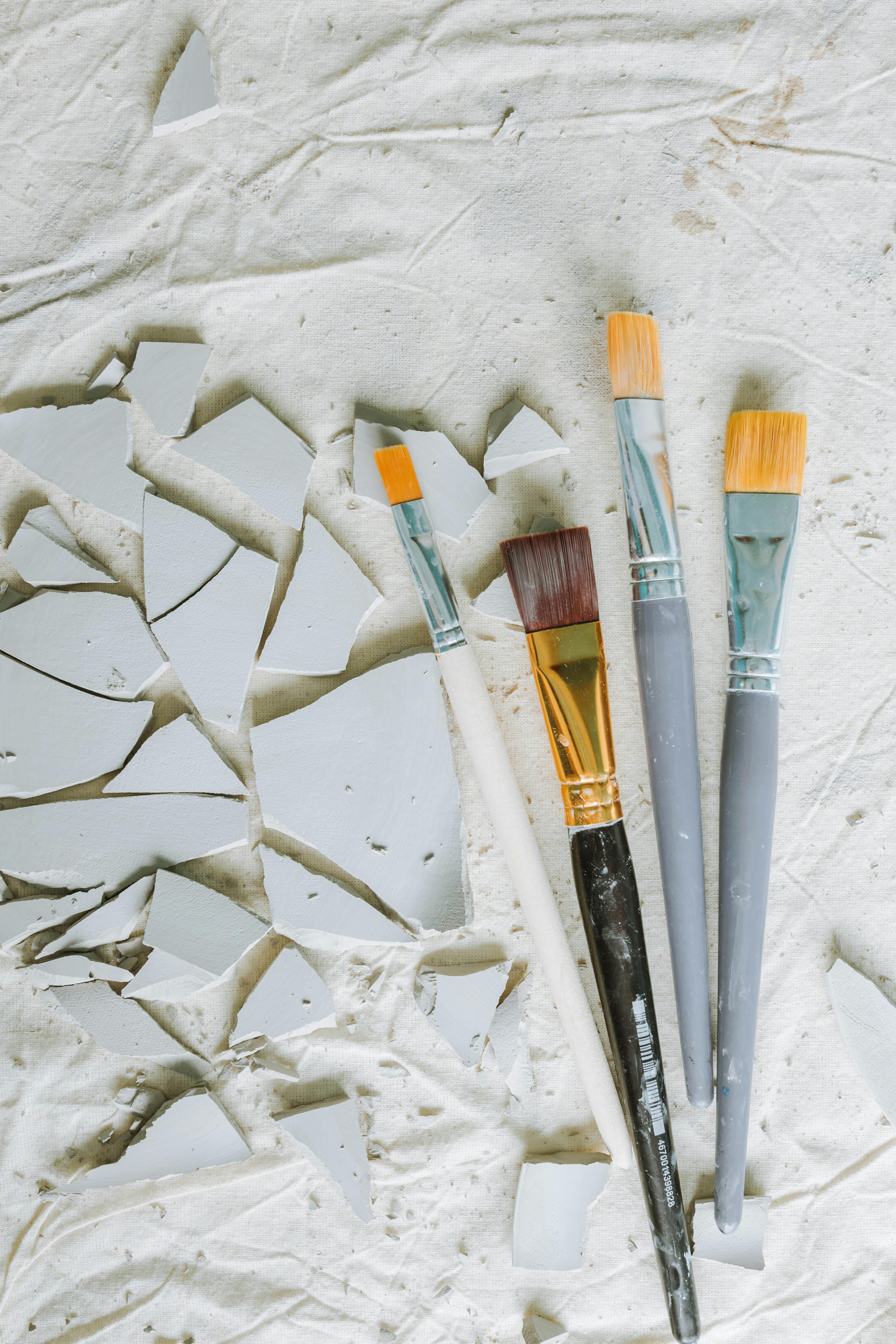 Painting Brushes on White Surface · Free Stock Photo