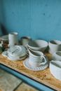 White Ceramic Teacup on Brown Wooden Tray