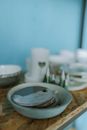 White Ceramic Plate on Brown Wooden Table