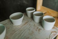 White Ceramic Mugs on Brown Wooden Table
