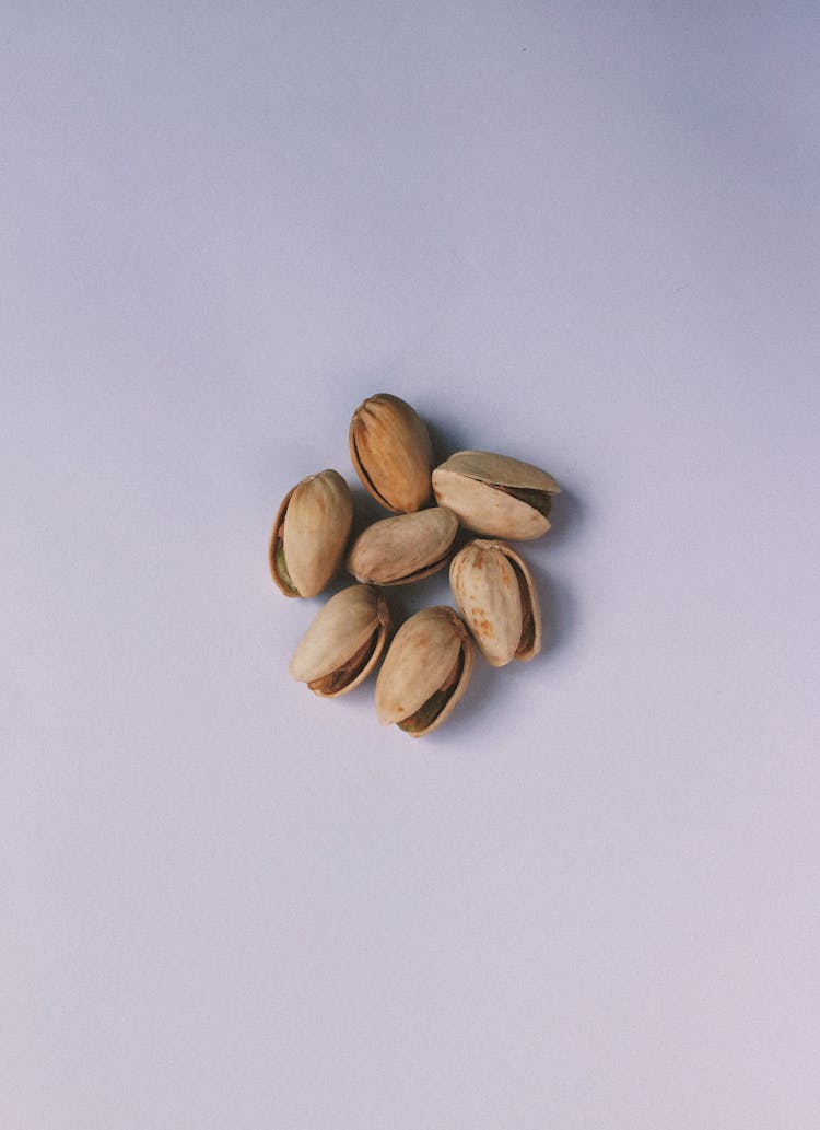 Pistachios On White Surface 