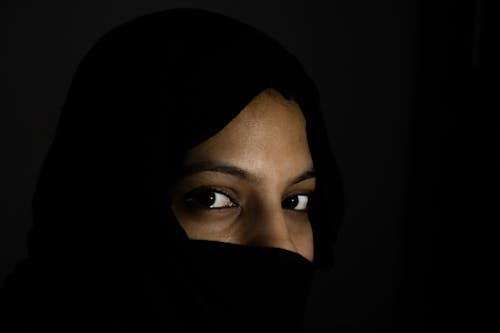 Free stock photo of female portrait, hijab, low light Stock Photo