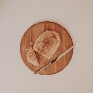 Rustic bread loaf on a wooden board — photo by Sarah on Pexels