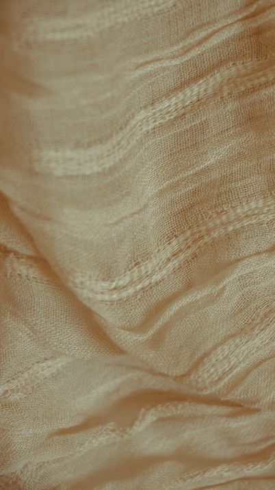 Close-up of beige woven linen showing its texture, photo by Sarah on Pexels