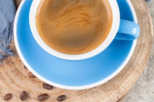 Free Top View of Coffee in Blue Cup and Saucer Stock Photo