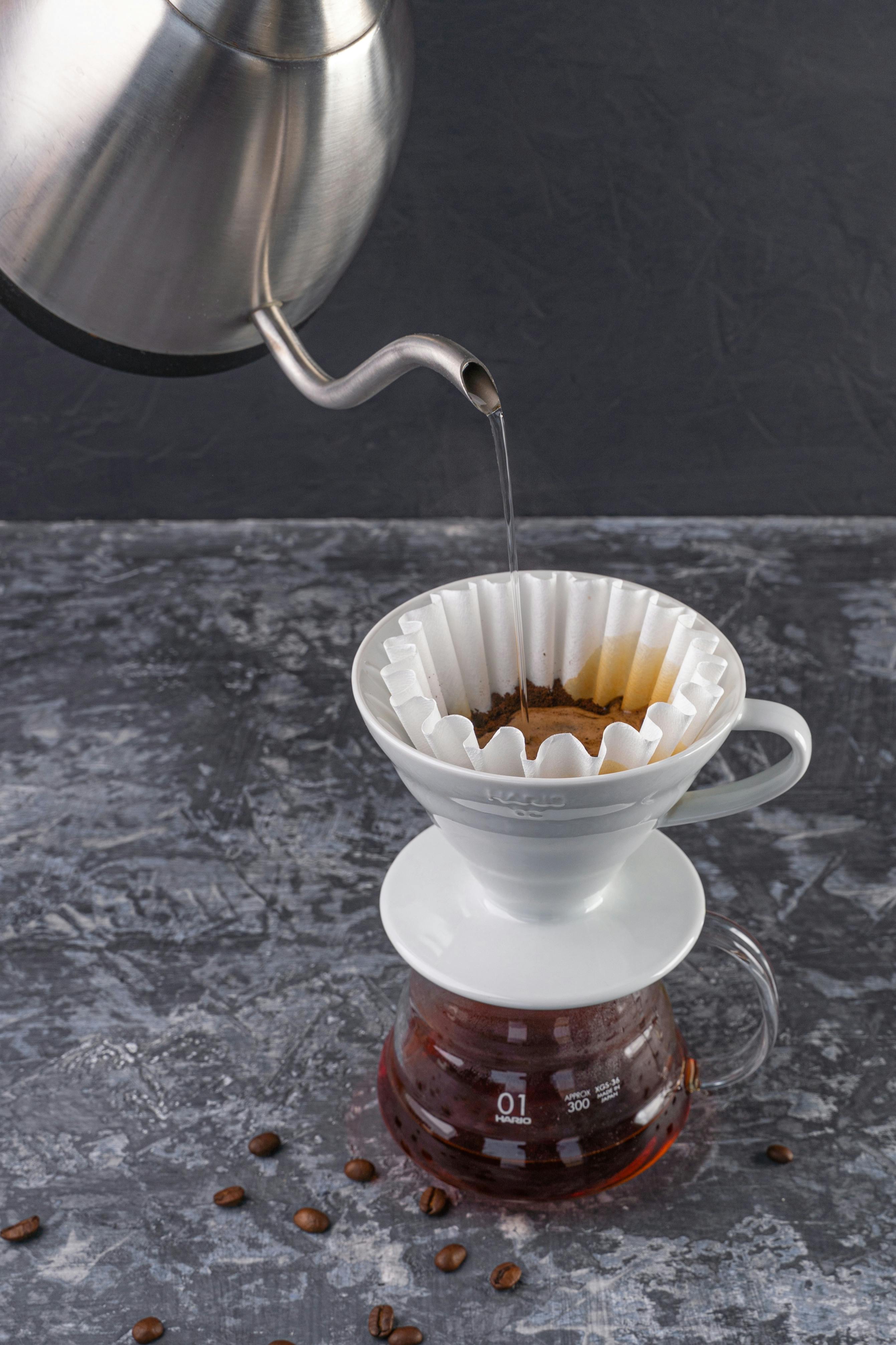 Woman Pouring Water to Cups from a Kettle · Free Stock Photo