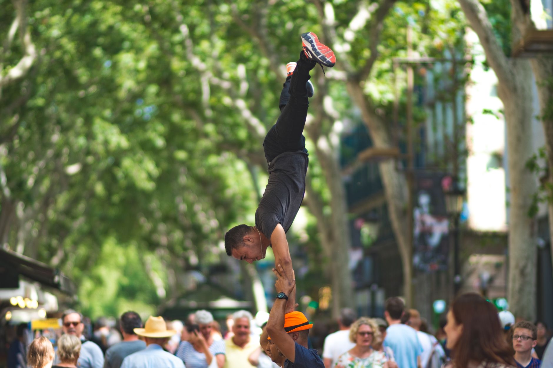 Dynamic street performers showcasing impressive acrobatics in vibrant Barcelona.