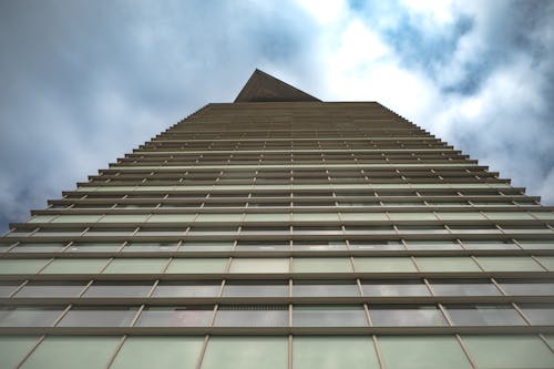 Low-Angel Photography of Brown Concrete Building Under the Sky