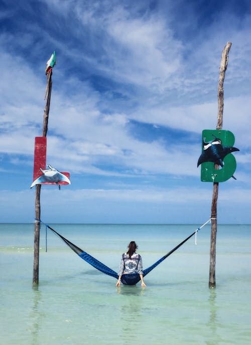 A Woman Sitting on the Hammock