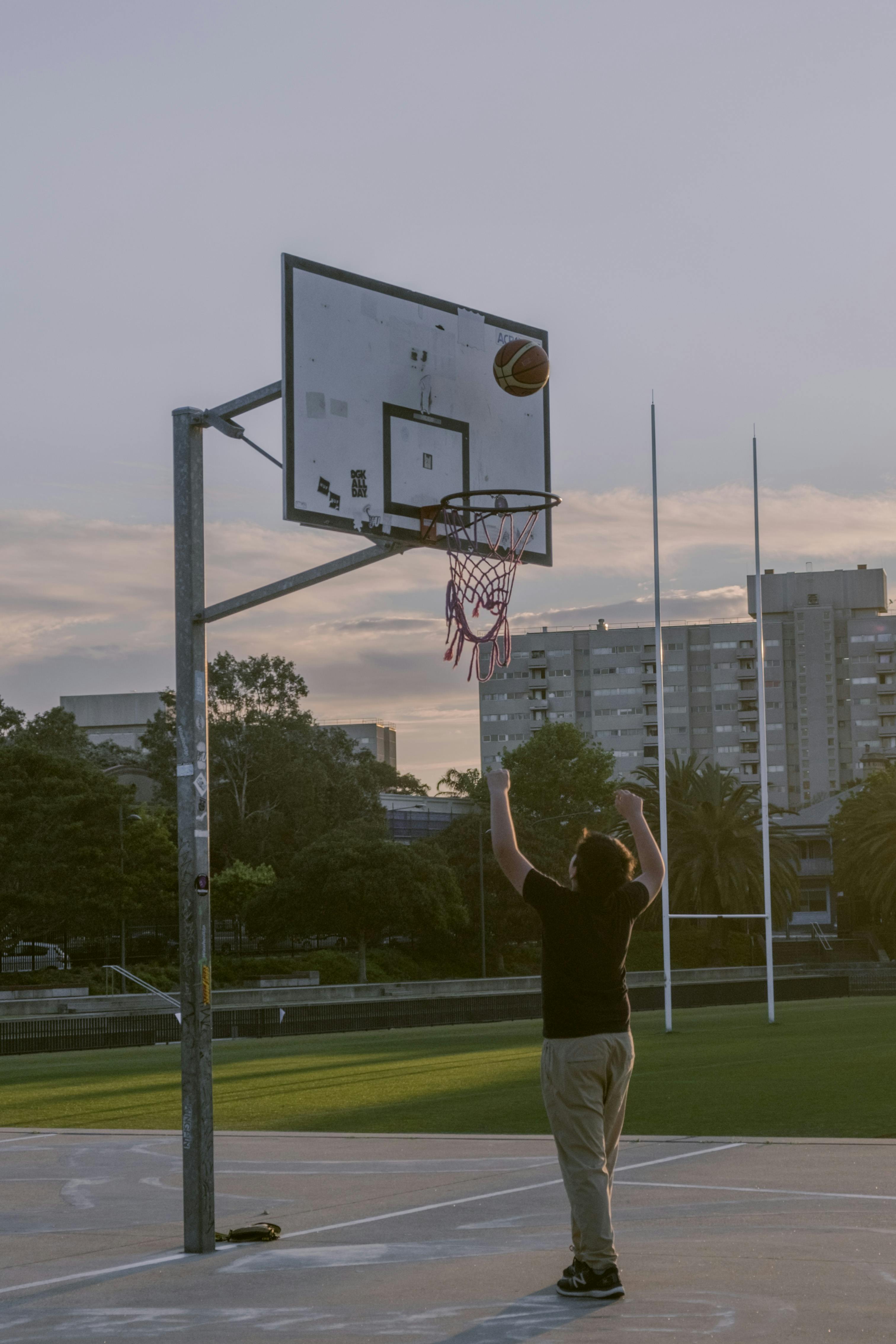 Woman in LA Lakers T-shirt and with Basketball Ball · Free Stock Photo