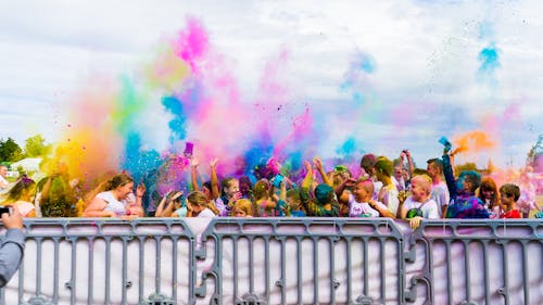 Free People Throwing Colored Powder Stock Photo