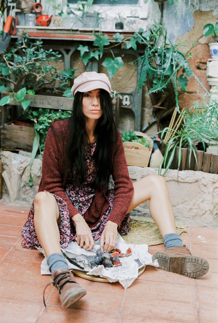 Woman Sitting On The Floor Eating Berries