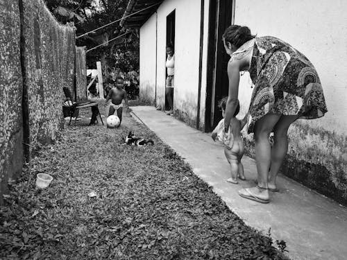 Monochrome Photo of a Mother Holding her Child