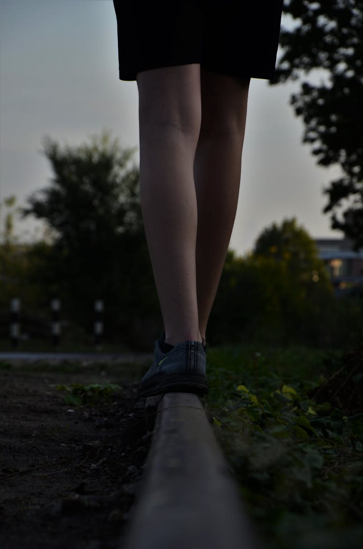 Photo Of A Person's Feet Balancing On A Surface