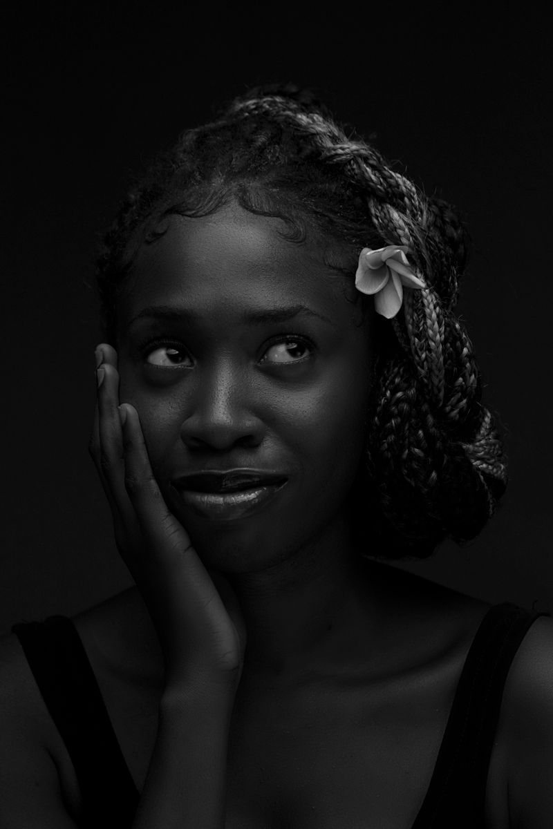 Woman with braided hair and flower