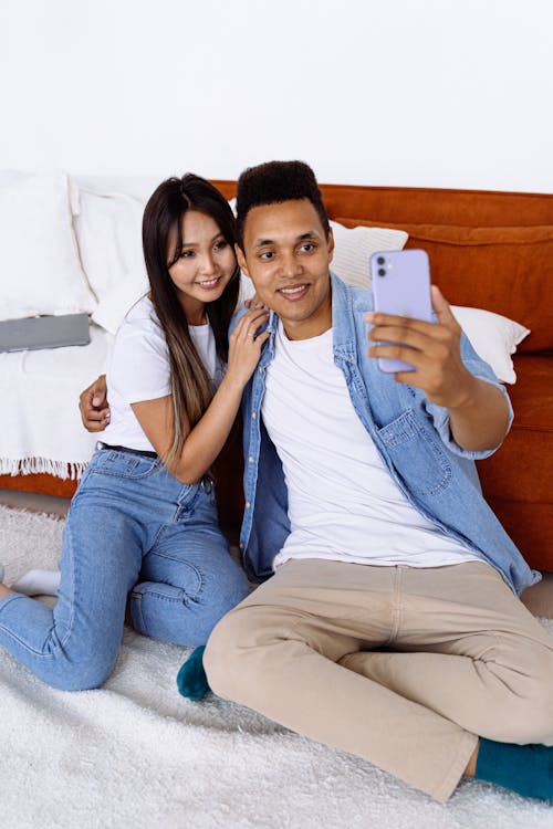 Man Taking Selfie with a Woman