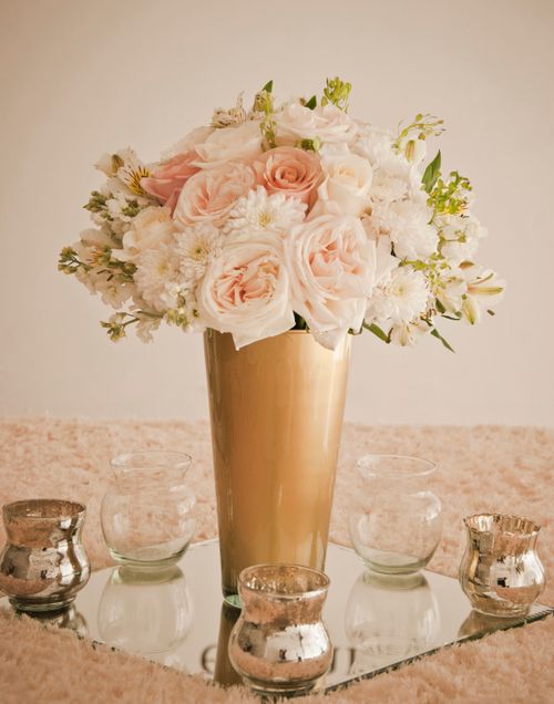 Free Elegant bouquet of roses and white flowers in a gold vase for special occasions. Stock Photo