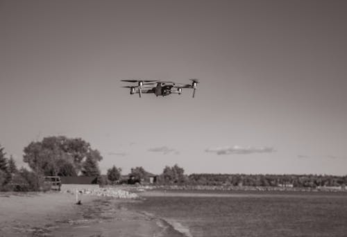 Free Grayscale Photo of Flying Drone Stock Photo