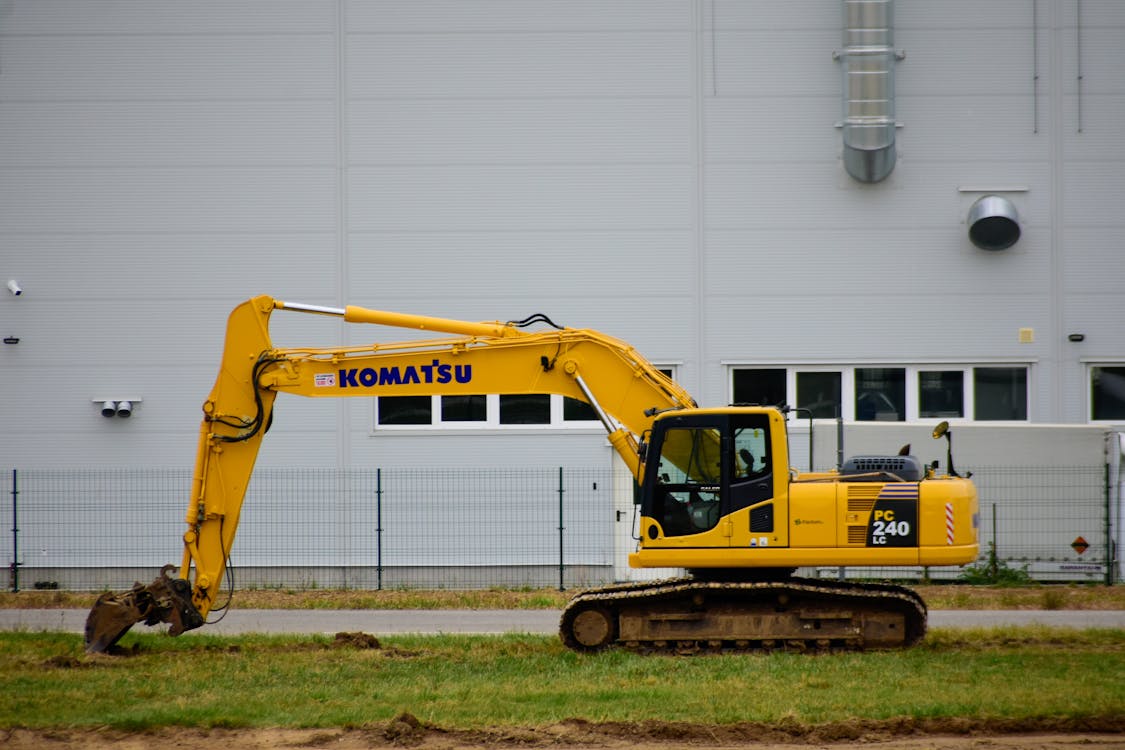 Yellow Excavator on Grass