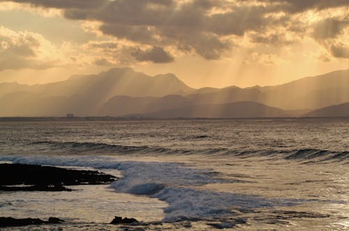 Silhoutte of Mountain Distant from Body of Water