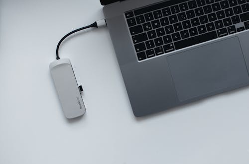 Laptop and USB hub on table