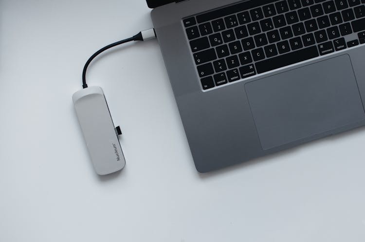 Laptop And USB Hub On Table