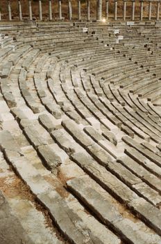 Detailed view of stone seating in the ancient Greek theater of Messini, Greece.