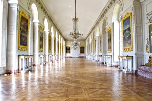 People Walking Inside White Building