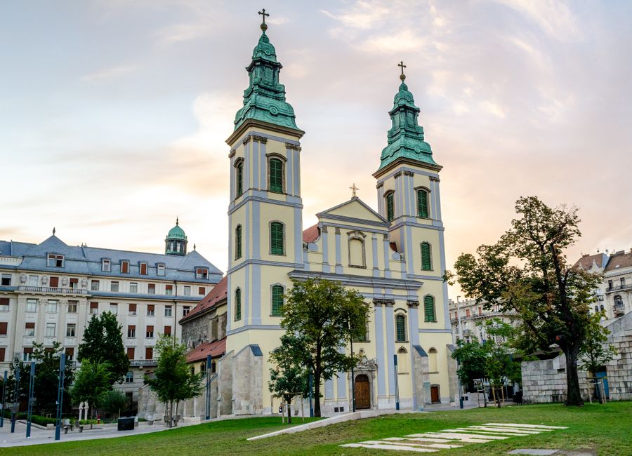 Discover the architectural beauty of a Baroque church in Budapest, Hungary captured at dusk.