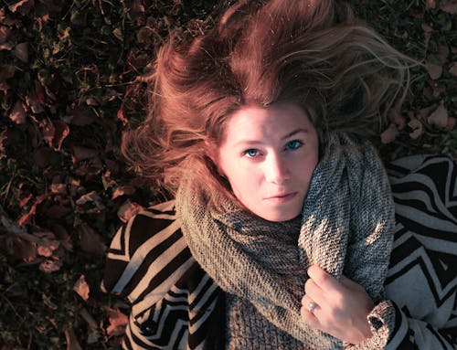 Free Woman Lying on Ground Stock Photo