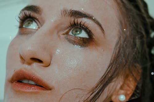 Woman with leaking mascara and wet face