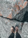 Person in boots standing on rough terrain