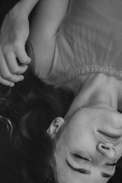 Free Black and white of peaceful female with pearl earrings relaxing in clean water Stock Photo
